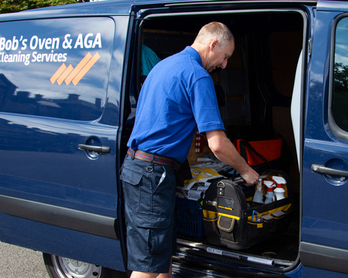 Bob preparing oven cleaning equipment at his van